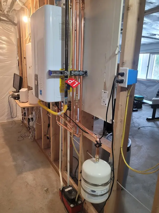 Licensed plumber repairing a kitchen sink in Mint Hill